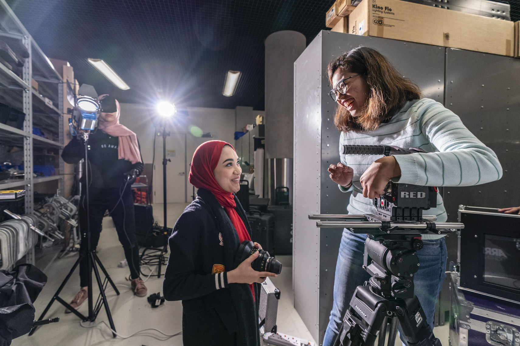 Students gather video equipment during a film class at a university in Doha, Qatar in a photo by Ryan Donnell