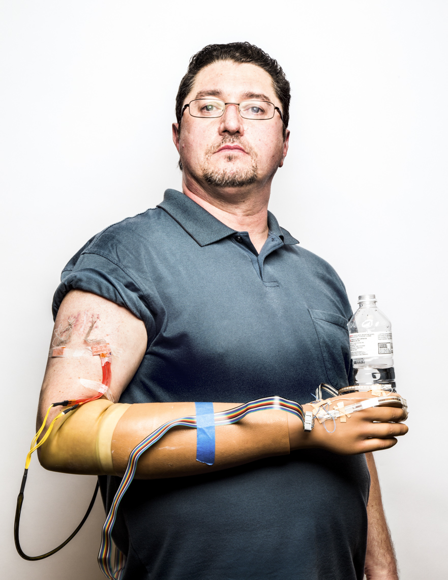 Portrait of a man with an artificial limb against a white background  by Washington DC photographer Ryan Donnell
