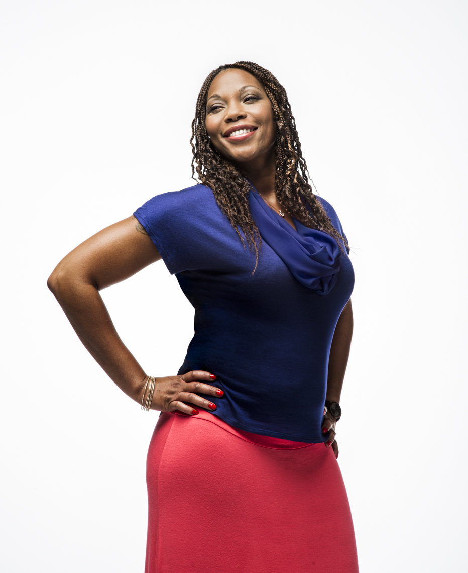 Portrait of happy African American woman against white background  by Washington DC photographer Ryan Donnell