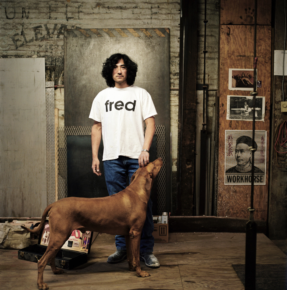  Editorial portrait of man in a t-shirt and standing with a dog by Washington DC photographer Ryan Donnell